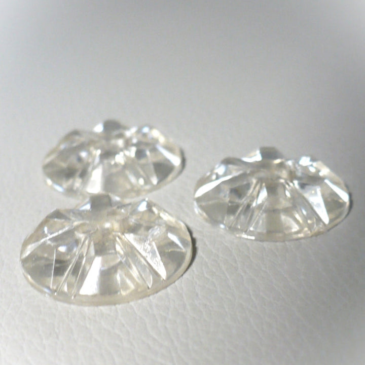 Backs of 30L Set of Three 1950s Clear as Crystal Lucite Two-Hole Buttons, 3/4", on gray background, view 2.
