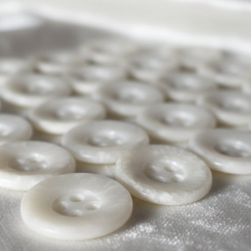 22L Set of 23 Four-Hole Speckled Casein White Buttons.