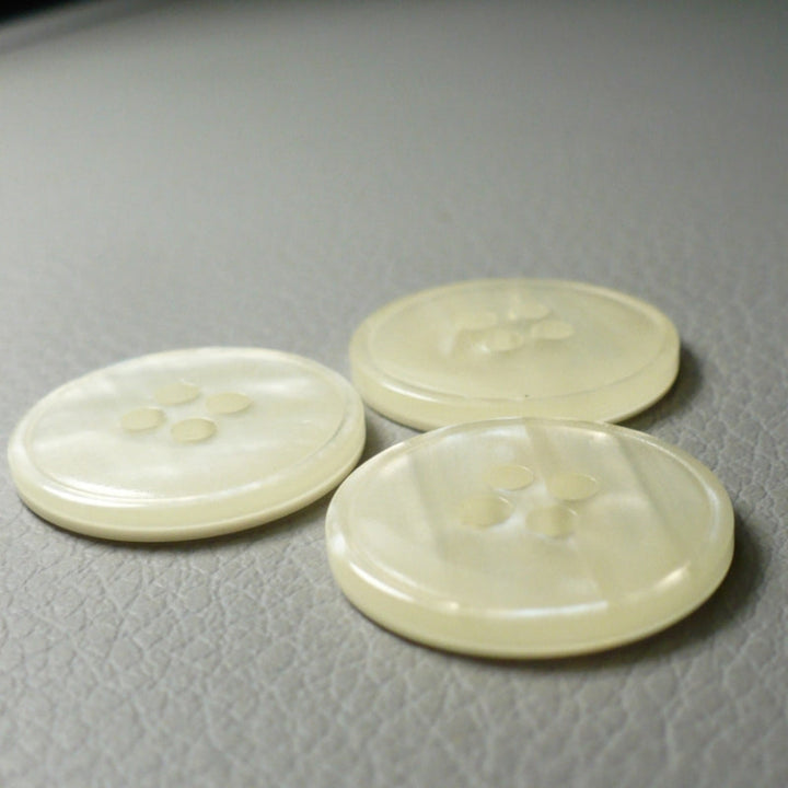 30L Set of Three Pearly White Layered Four Hole Buttons, 3/4", sides arranged on a textured gray background.
