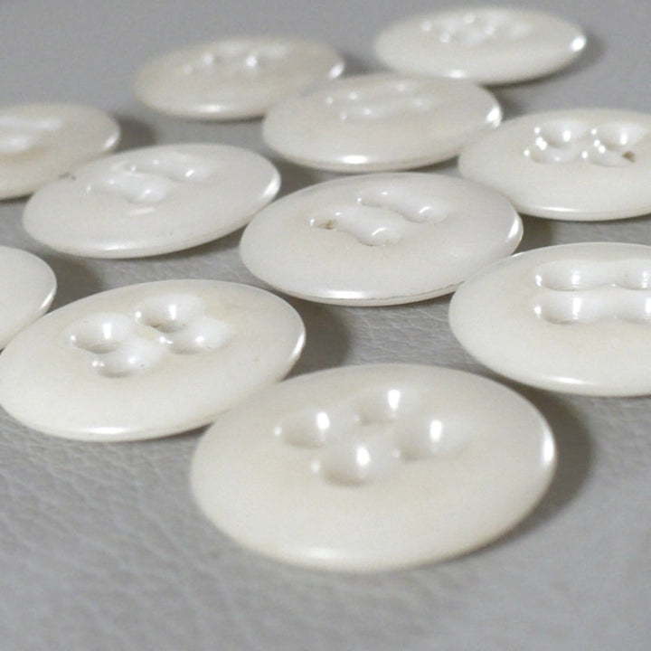 27L Set of 13, 1940s Matte Off-White Four-Hole Casein Buttons.