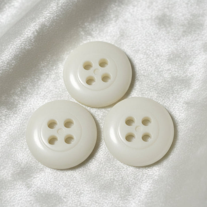 27L Set of Three Matte Off-White Four Hole Casein Trouser Buttons.