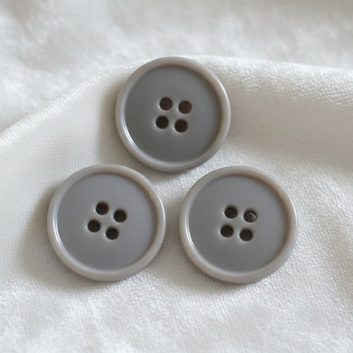 30L Set of Three Grey Four Hole Plastic Buttons, 3/4".