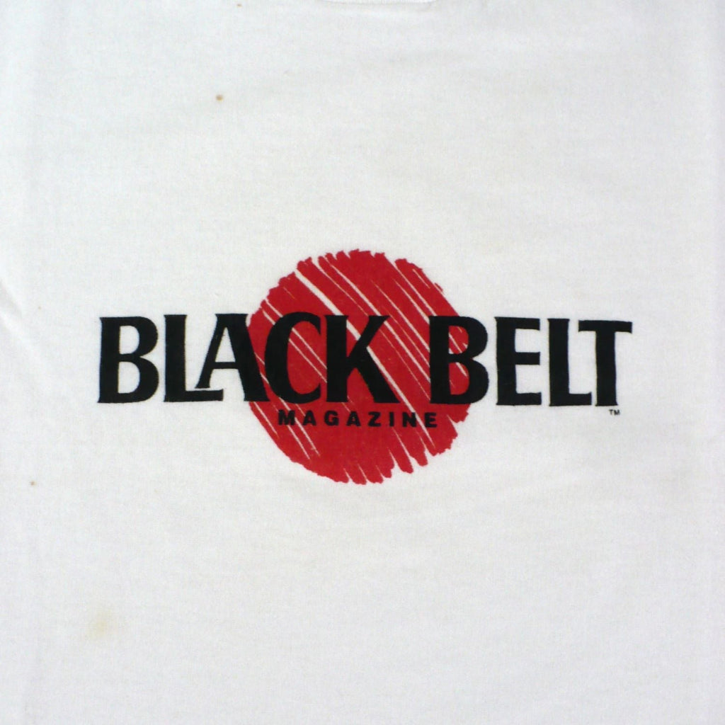 Vintage 1980s white t-shirt with 'Black Belt' logo, actual enlarged for detail.