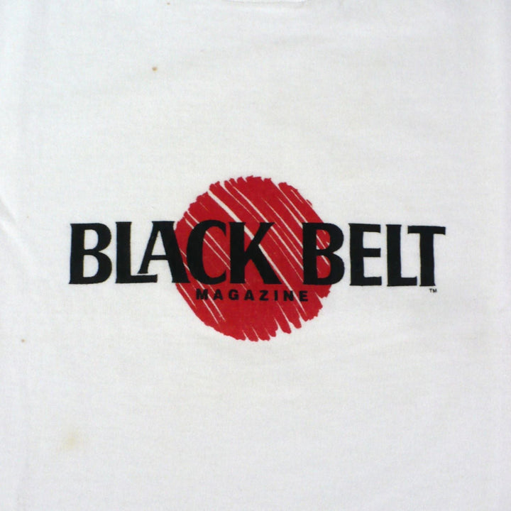 Vintage 1980s white t-shirt with 'Black Belt' logo, actual enlarged for detail.