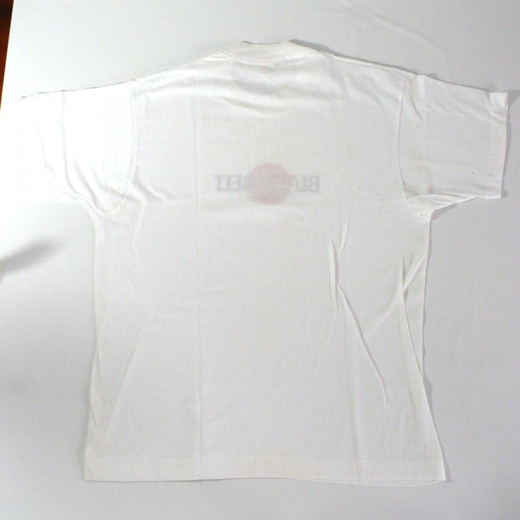 Vintage 1980s white t-shirt with 'Black Belt' logo,plain back of shirt, on a white table top background.