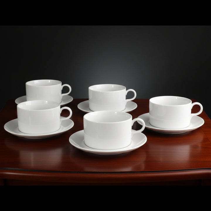 Set of five LaGardo Tackett 1960s Airline Flat Cup & Saucer Set, Schmid Porcelain.on a table.