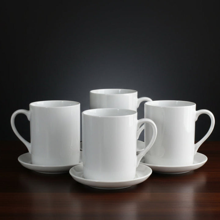 Set of four white ceramic 1960 LaGardo Tackett Slim White Tack Espresso Cup & Saucer Sets  on a dark background.