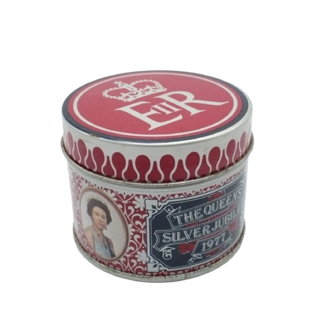 A round metal Matchbox Tin with a red and silver design, featuring 'The Queen's Silver Jubilee 1971' text and a portrait of Queen Elizabeth on the front, set against a plain white background.