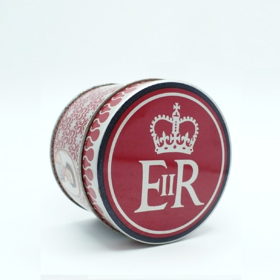 A round cylindrical Matchbox Tin with a red lid featuring a white crown and the letters 'E II R' in white, shown on a plain white background.