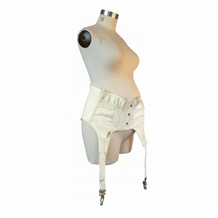 Extremely Rare 1928–1935 Maternity Suspender Belt on a dress form, AI image.
