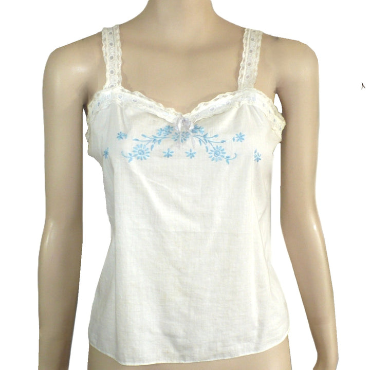 Woman wearing a white Edwardian Cambric Corset Cover on mannequin with plain background.