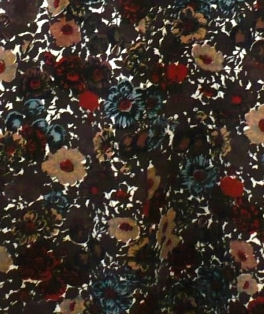 Floral patterned fabric with multicolor flowers on a dark background