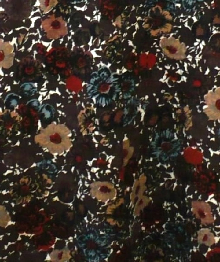 Floral patterned fabric with multicolor flowers on a dark background