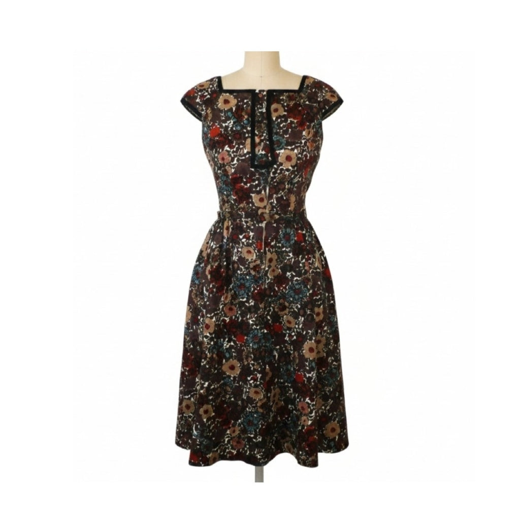 A knee-length floral dress with cap sleeves and a square neckline, displayed on a mannequin against a plain white background.