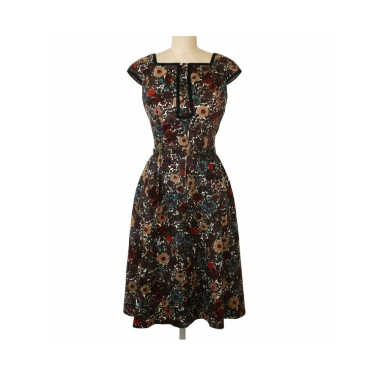 A knee-length floral dress with cap sleeves and a square neckline, displayed on a mannequin against a plain white background.