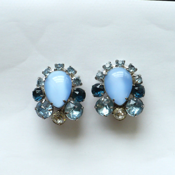 Front view of 1960s Blue Rhinestone & Moonglow Lucite Mid-century Cocktail Earrings.