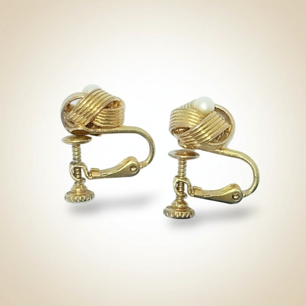 1960 Gold-tone Love Knot with Pearl Fashion Earrings, side view.