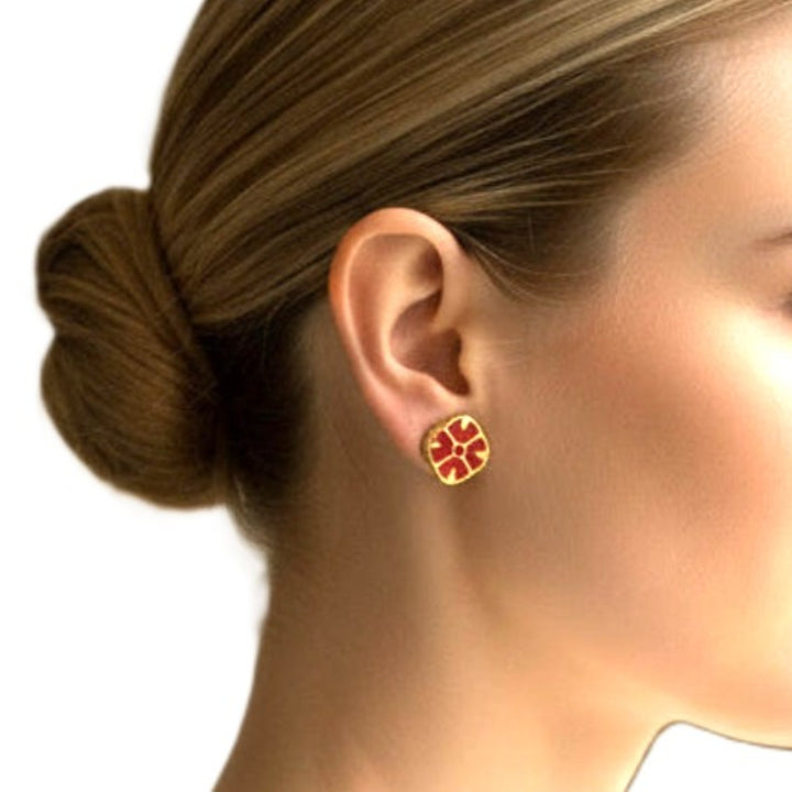 1980s Vintage Regal Red and Gold Tone Givenchy Fashion Clip-on Earrings on woman.