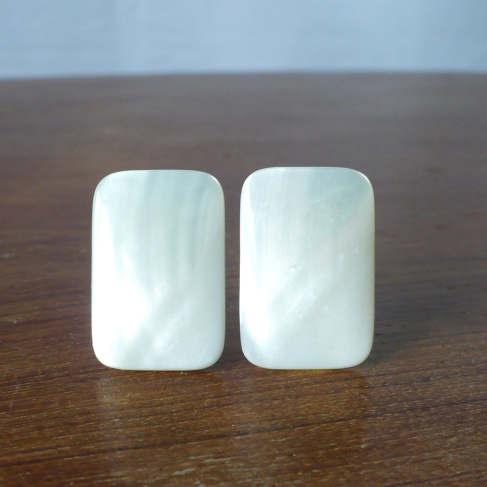 1980s Mother of Pearl Gemstone Earrings - Clip On - resting on wood table.