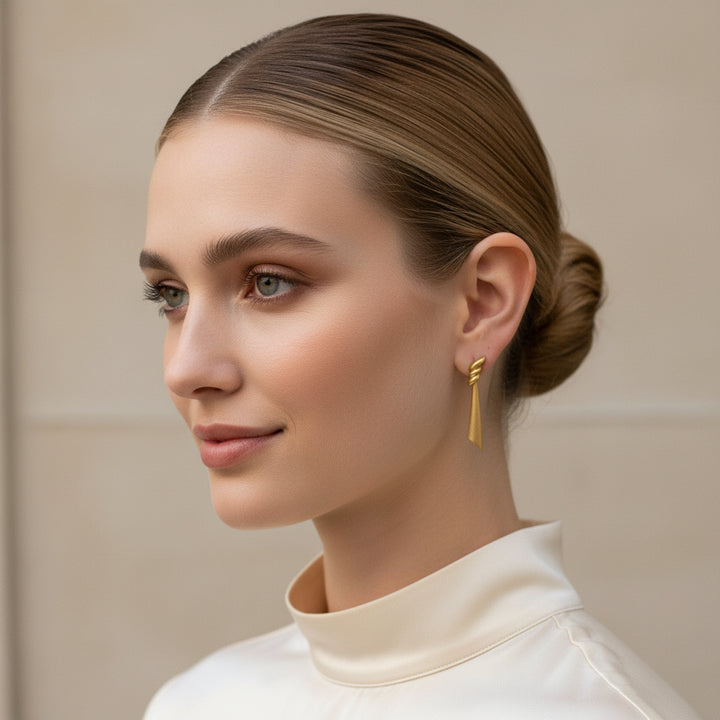 1980 Vintage Classical Draped Gold Tone Pierced Metal Earrings by Monet.