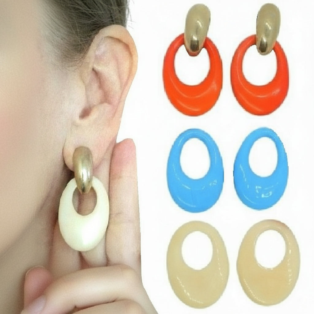 A collection of 1980s interchangeable door knocker pierced hoop earrings in gold-tone metal with porcelain accents, displayed in white, beige, blue, and orange colors.