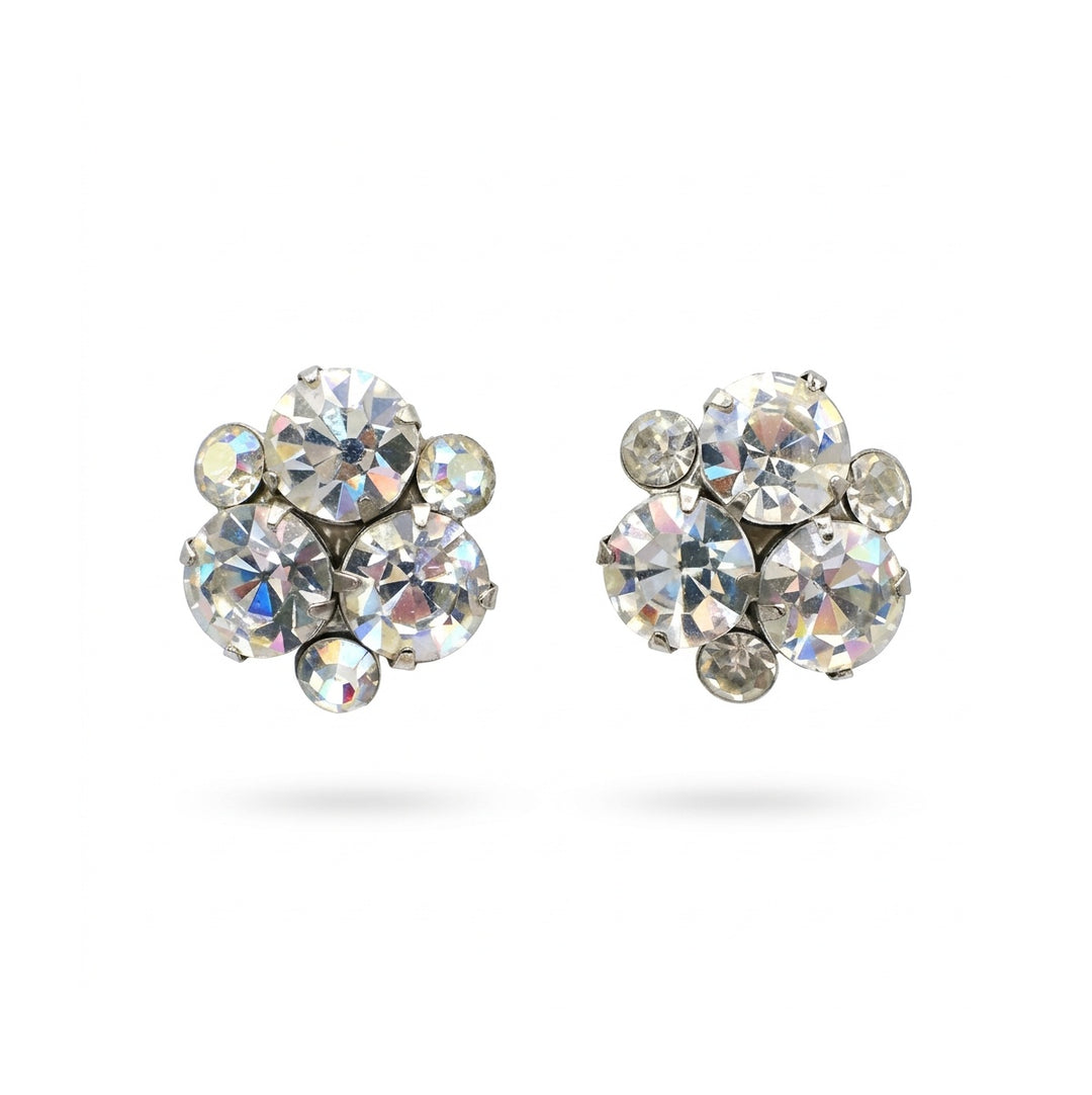A pair of silver-tone stud screw-back cocktail earrings featuring six clear faceted crystals set against a plain white background.