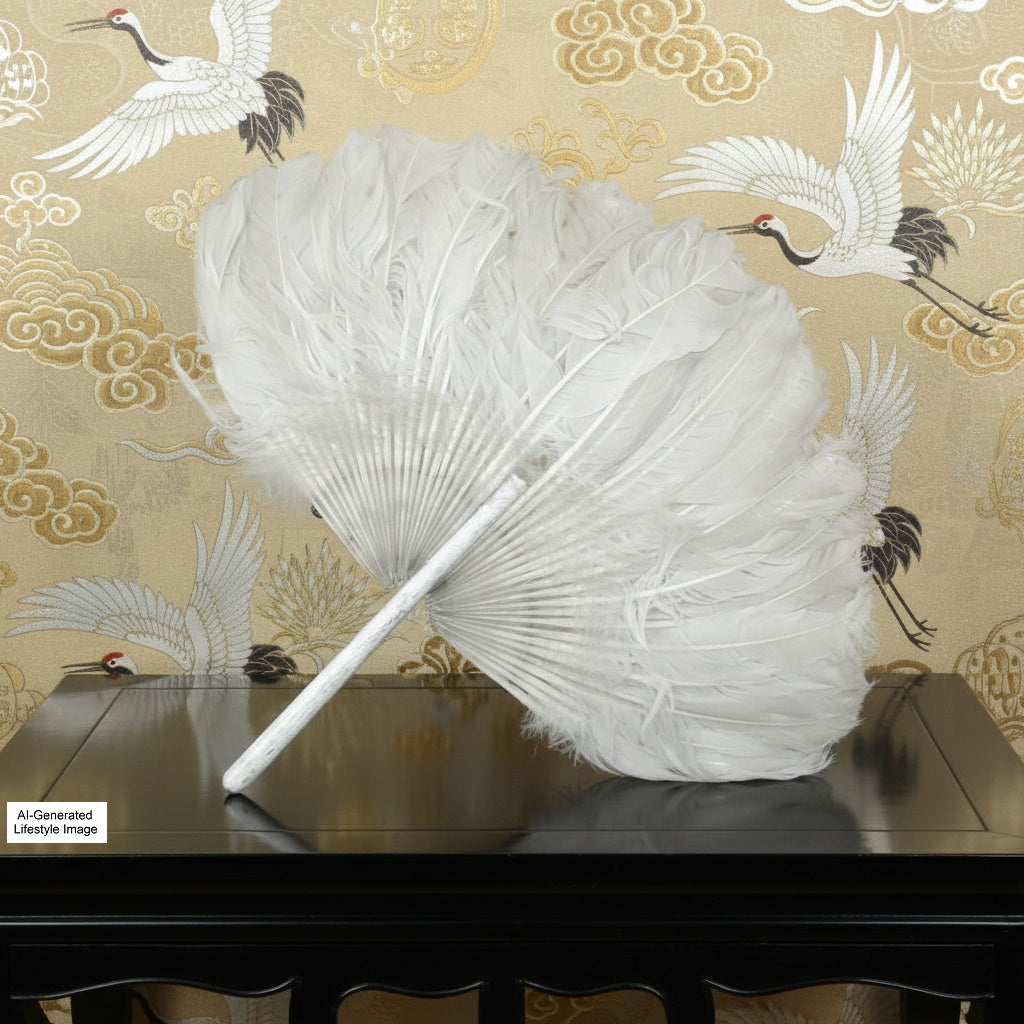 White feathered fan on a wooden table with decorative wallpaper featuring cranes in the background.