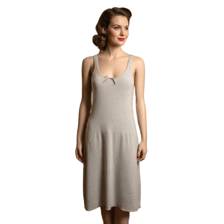 Woman wearing a 1940s Vintage Wartime Indera Figurefit Knit Cotton Summer Full Slip on a white background.
