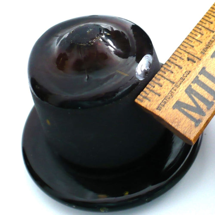 View of glass topper with chip and ruler, 1930 Amber Fosfato de Tricalcico Apothecary Jar.
