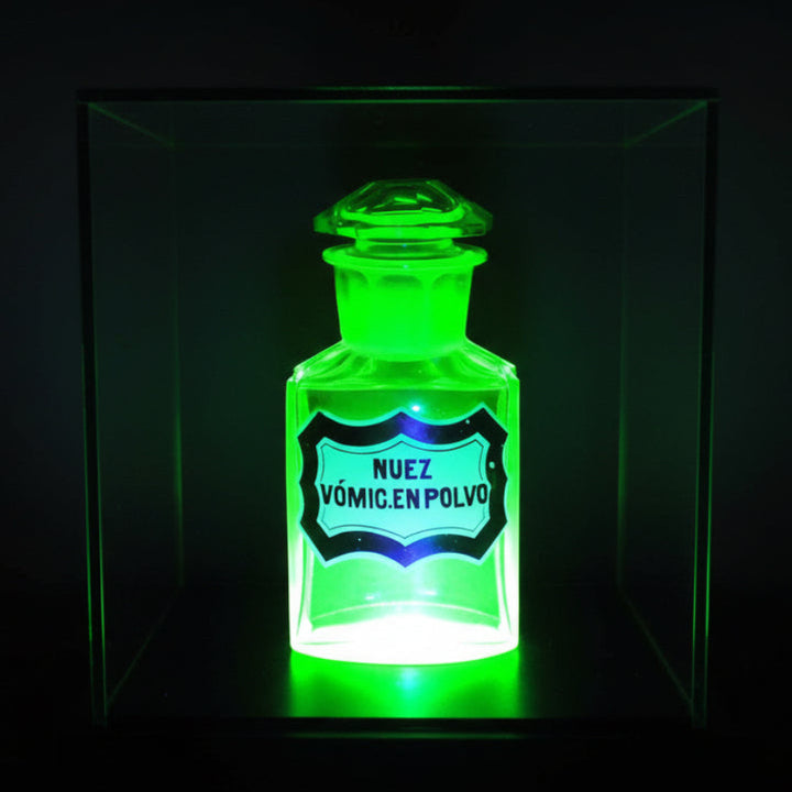 Uranium glass apothecary bottle .