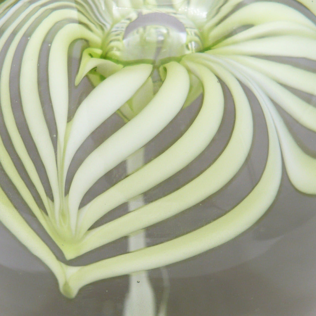 A close-up of a petal on th eflower of 1960s Cristaleria Querandi Paperweight.