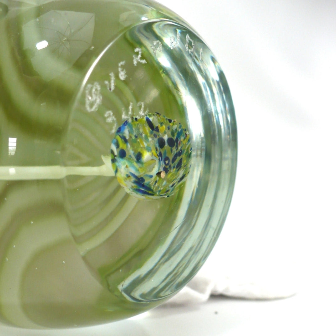 A close-up of the base showing etched signature 1960s Cristaleria Querandi Paperweight and number 342. 