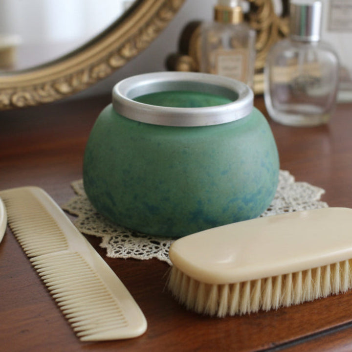 1920 Muller Frères France Hair Receiver on a vanity with a celluloid comb and brush.