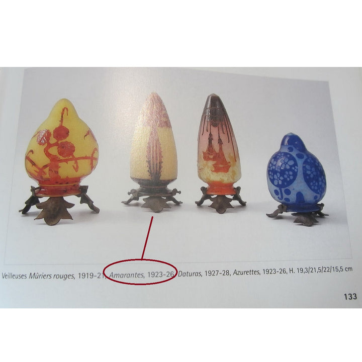 A printed catalog page of Schneider lamps for reference.