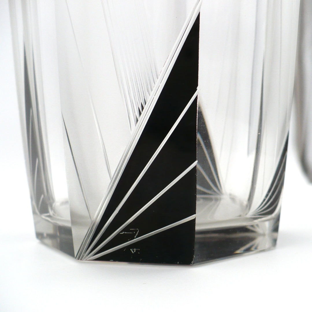 A close-up view of wear on black enamel of A vintage 1930s Karl Palda Art Deco Crystal Cocktail Shaker.
