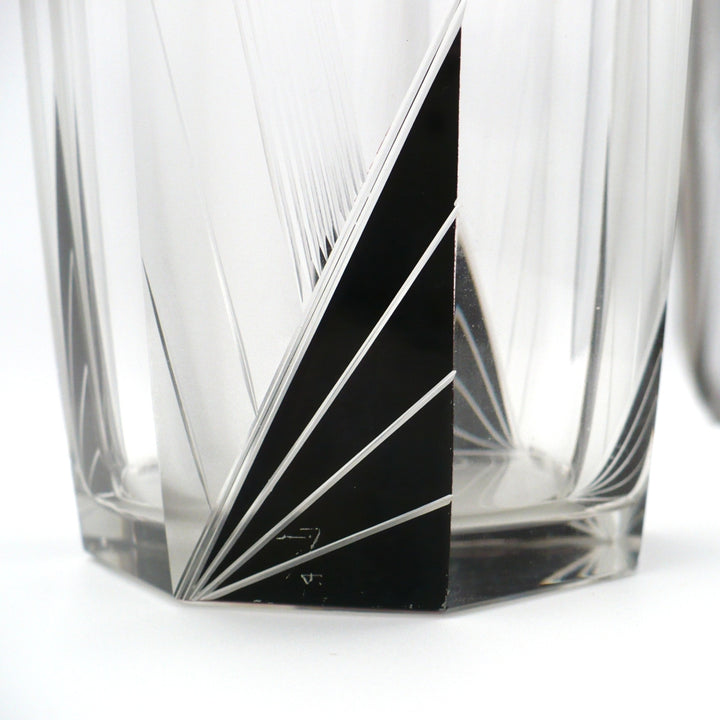 A close-up view of wear on black enamel of A vintage 1930s Karl Palda Art Deco Crystal Cocktail Shaker.