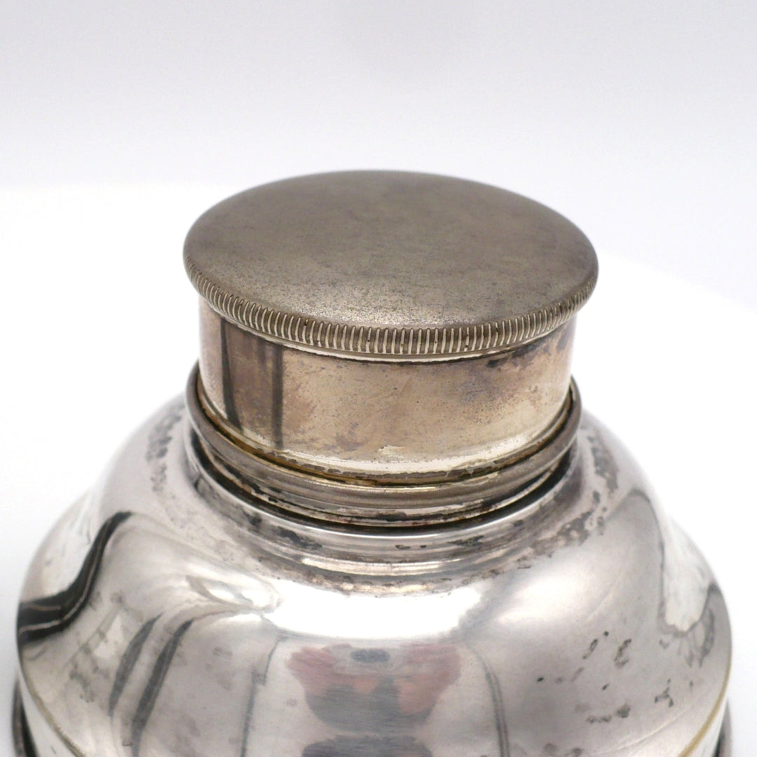 A close-up of the condition of the cap on 1930s Karl Palda Art Deco Crystal Cocktail Shaker.