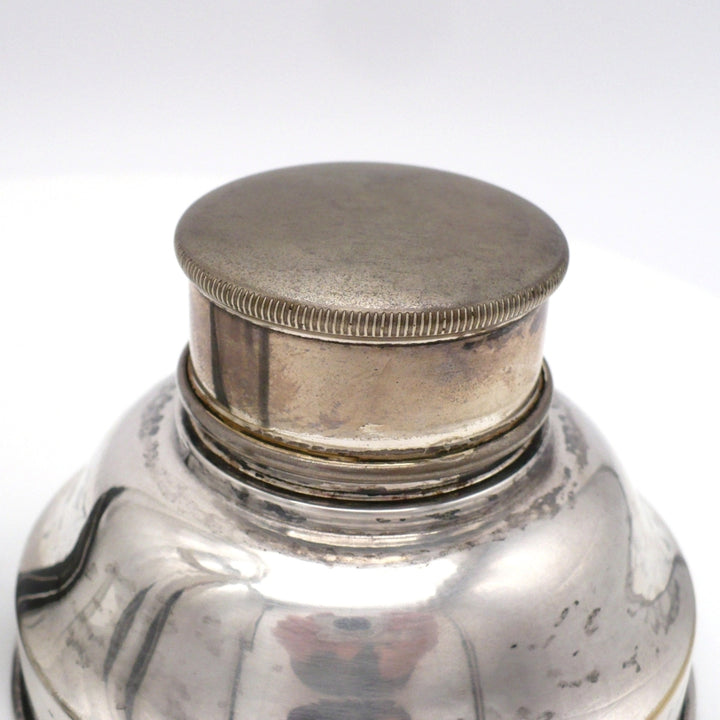 A close-up of the condition of the cap on 1930s Karl Palda Art Deco Crystal Cocktail Shaker.
