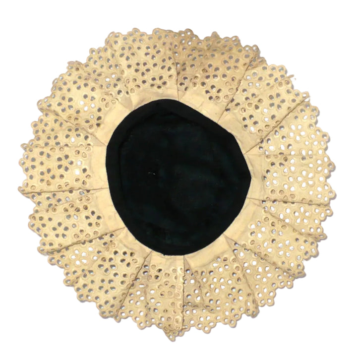 Interior view of antique mobcap hat highlighting the lining and vintage construction details.