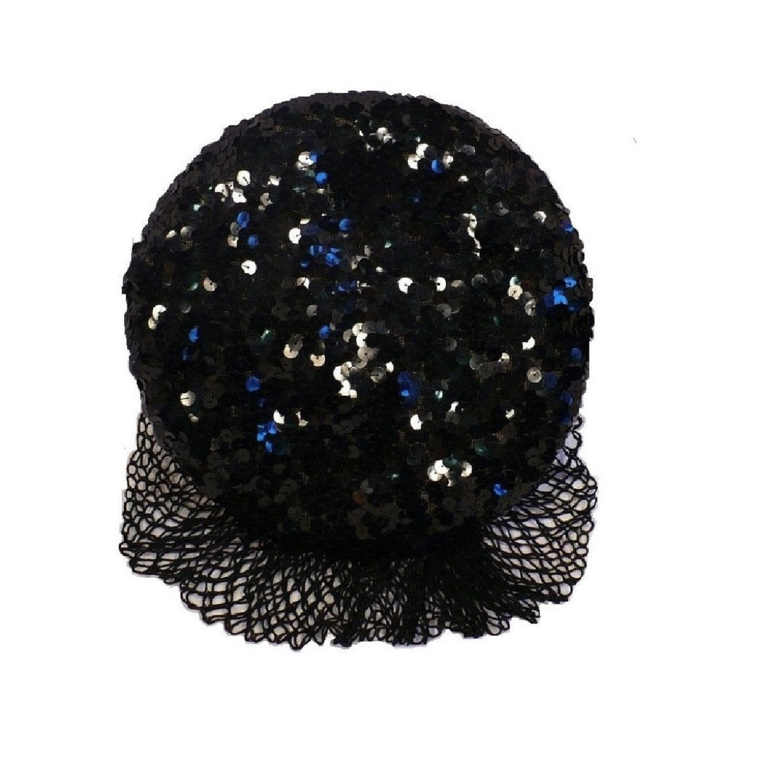 Detailed top-down photograph of a 1930s black gelatin sequined cocktail beret hat with a matching mesh veil.