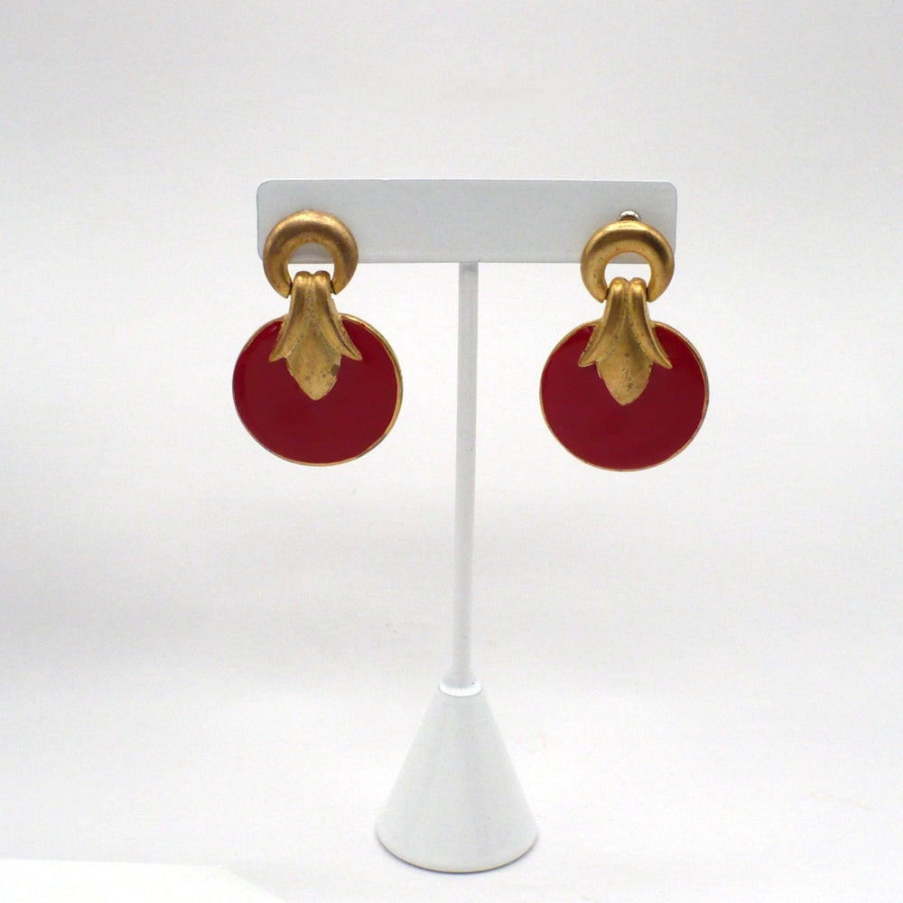 1980s vintage neo-baroque scarlet red and gold-tone door knocker statement earrings displayed on a white t-stand.