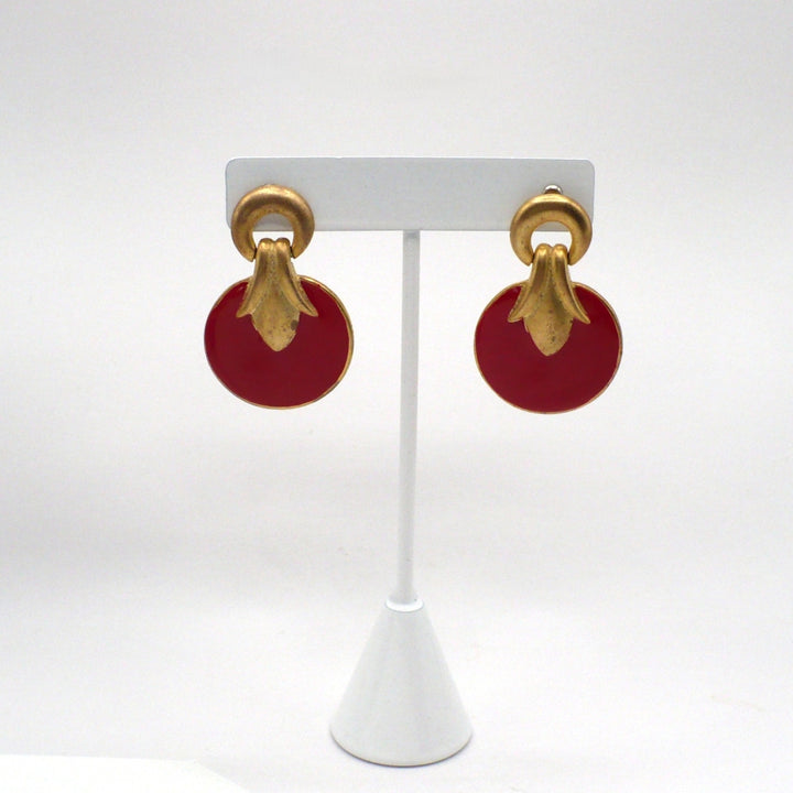 1980s vintage neo-baroque scarlet red and gold-tone door knocker statement earrings displayed on a white t-stand.