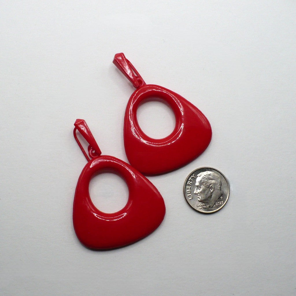 Vintage 80s lipstick red geometric statement earrings, hypoallergenic non-metal plastic drop jewelry, mod revival space age fashion accessory., on flat surface next to a dime for scale.