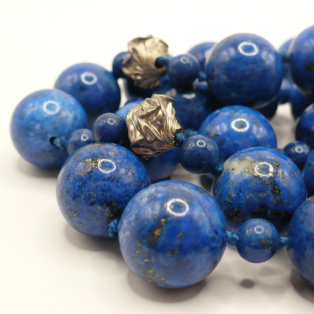 Close-up of the 1970s vintage lapis lazuli beads and ornate silver accent beads.