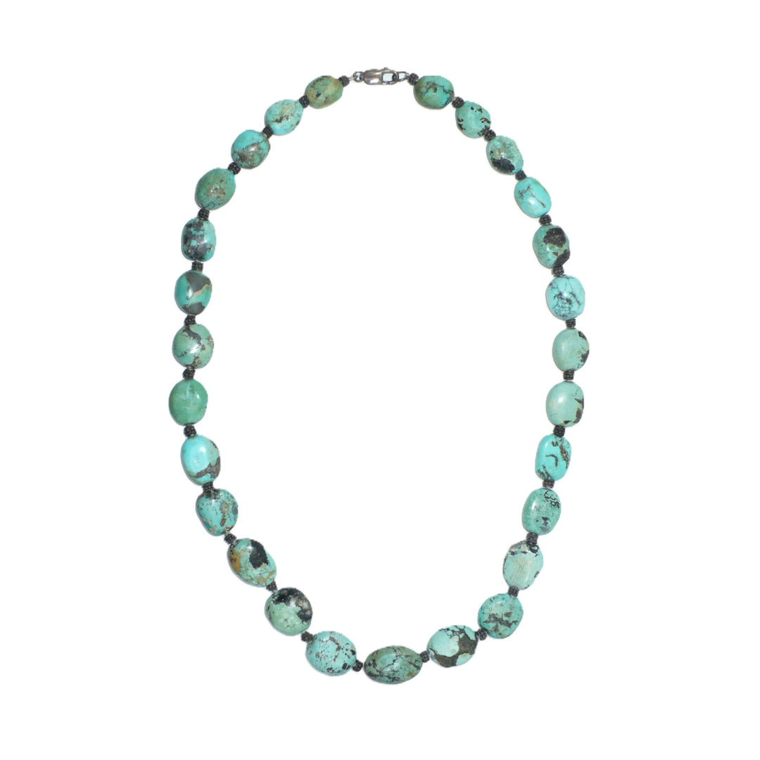1970s vintage bohemian necklace featuring chunky Hubei turquoise nugget beads and sterling silver spacers.