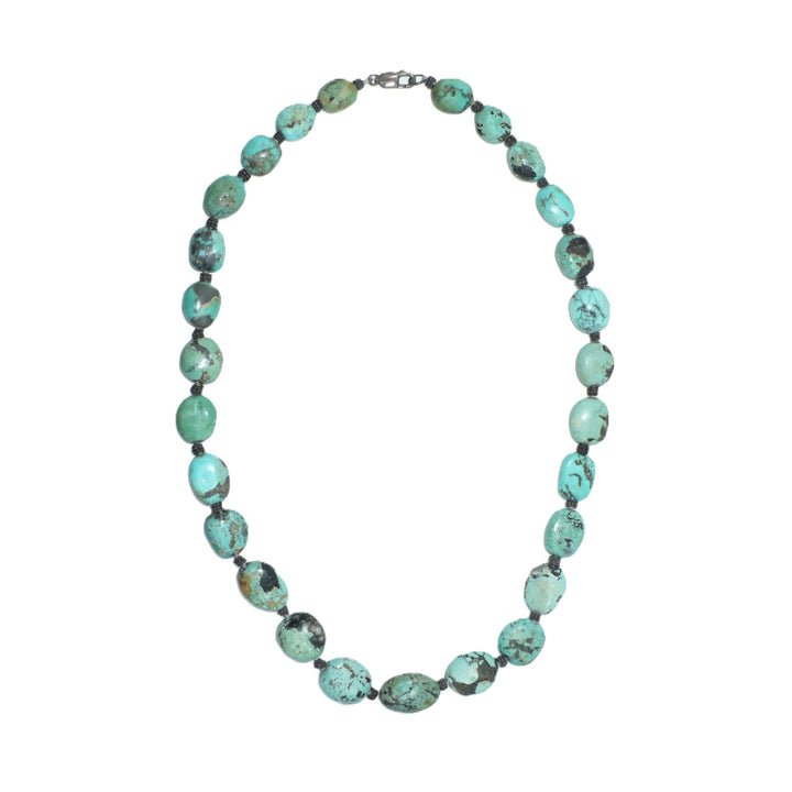 1970s vintage bohemian necklace featuring chunky Hubei turquoise nugget beads and sterling silver spacers.