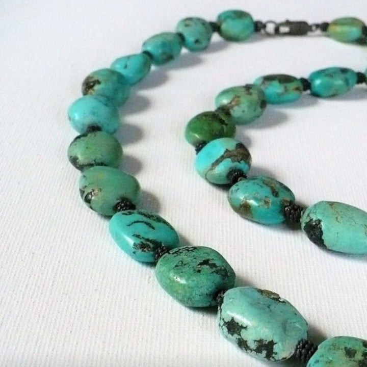 1970s vintage bohemian necklace featuring chunky Hubei turquoise nugget beads and sterling silver spacers.