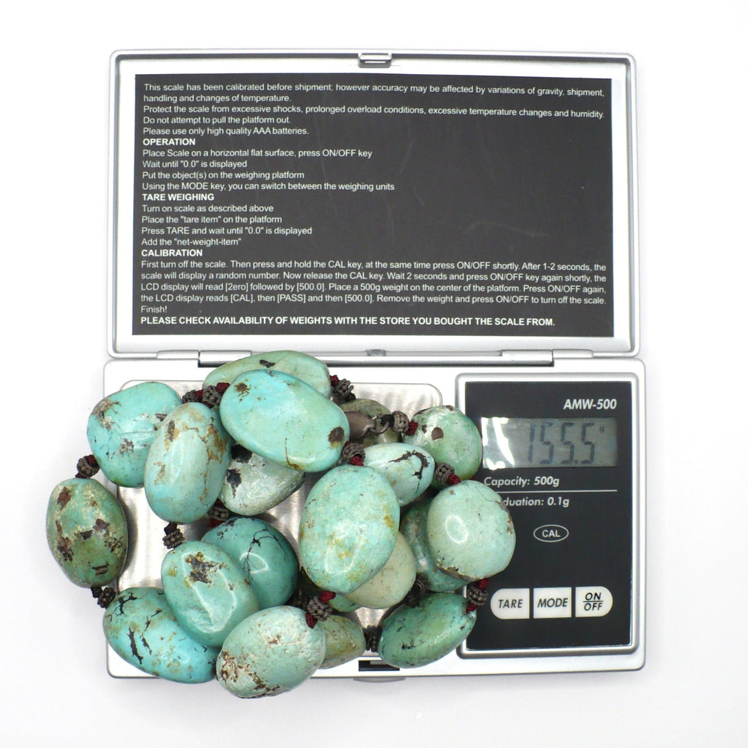 1970s Vintage Chunky Hubei Turquoise Nuggets Sterling Beaded Necklace on jewelry scale shows 155.5 gram weight.