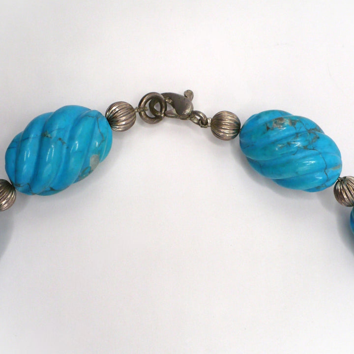 1970s Vintage Blue Howlite and silver beaded Necklace on dress form chows silver lobster clasp.