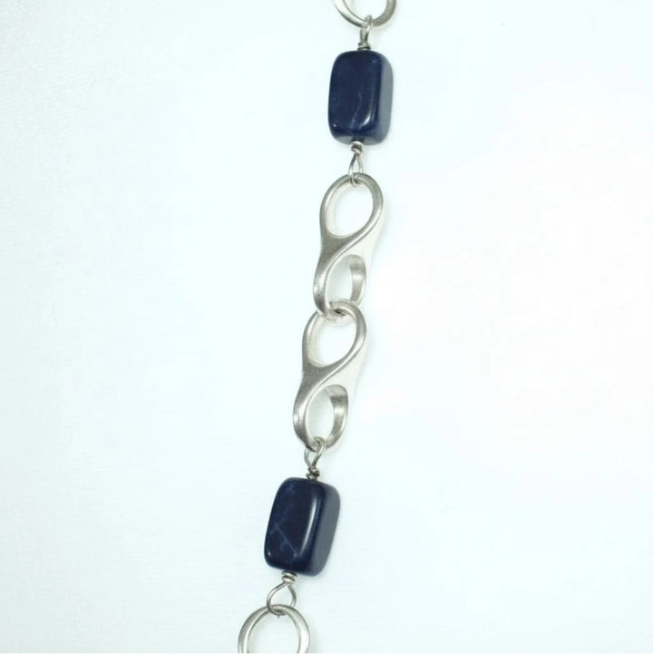 Close-up detail of 1970s vintage modernist sterling silver links and blue sodalite station necklace.